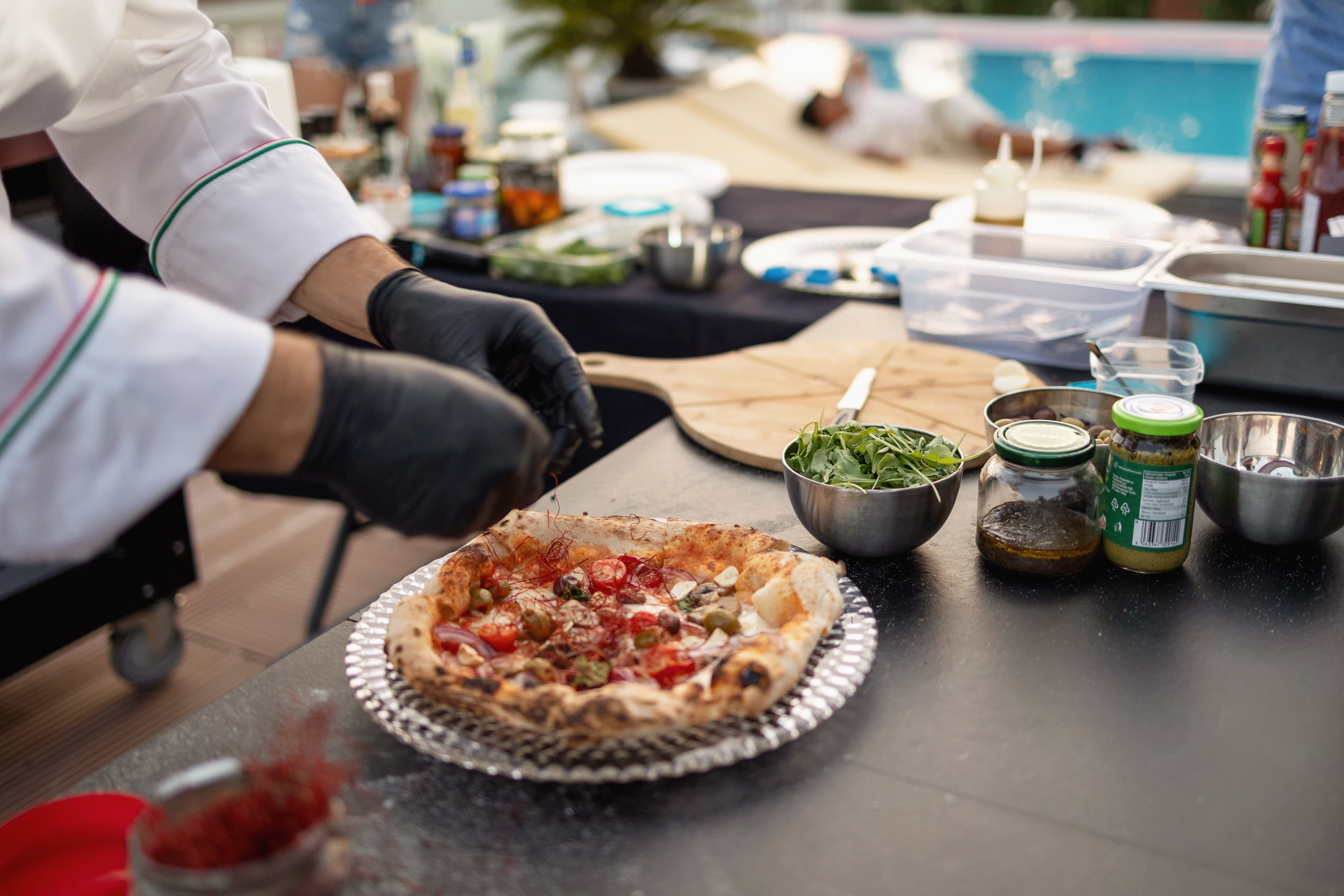 Fresh Neapolitan pizza served poolside at Villa GG